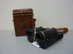 Pair Dolland London x8 magnification prism binoculars with tooled leather decoration L11cm in