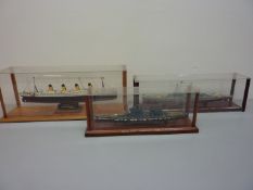 Three ship models in display cases - R.M.S. Titanic, H.M.S.