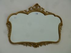 Wall mirror in shaped gilt frame,