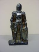 Enamelled cast iron fireside companion set in the form of a knight 35.