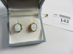 Pair of opal ear-studs stamped 375