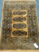 Small fine Pakistani Bokhara gold ground rug,