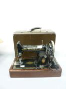 1950s electric Singer sewing machine with accessories