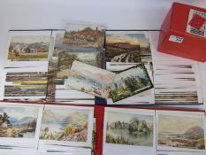 Box of Leeds postcards and two albums of postcards