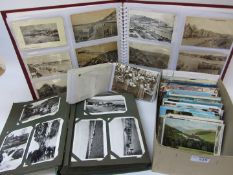 Collection early 20th century and later loose postcards and in three albums