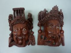 Pair mid 20th century Chinese wall face masks H20cm