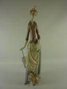 Lladro figure of a lady with dog and umbrella H36cm