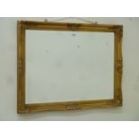 Rectangular wall mirror in gilt swept frame,