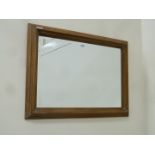 Rectangular bevelled edge wall mirror in stepped oak frame,