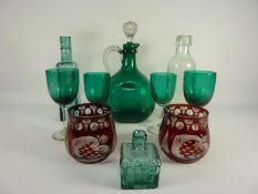 Edwardian green glass claret decanter, four similar glasses,