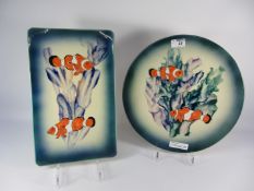 Large circular goldfish platter and a similar rectangular platter