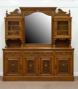 Edwardian oak bevelled mirror back sideboard fitted with two cupboards either side,