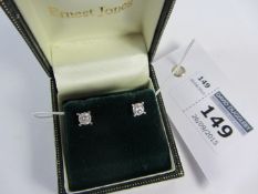 Pair of diamond stud ear-rings stamped 750 approx 0.