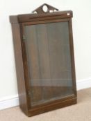 Early 20th century mahogany display cabinet enclosed by single glazed door, W64cm,