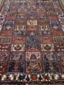 Persian Bakhtiari garden panel design red ground rug, 177cm,