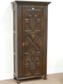 Early 20th century 'Denby & Spinks' oak hall wardrobe enclosed by single panelled door with carved