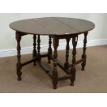 18th century country oak oval drop leaf table on turned gateleg base,