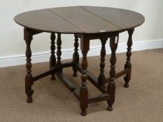 18th century country oak oval drop leaf table on turned gateleg base,