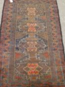 Persian Balochi red and black ground rug,