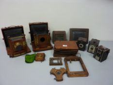 Two 19th/20th century mahogany and brass plate cameras, with five double sided mahogany plates,