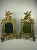 Pair of gilt metal Rococo design table photograph frames surmounted by cherubs H34cm