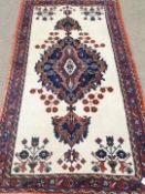 Persian Hamadan central medallion cream and red ground rug,