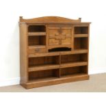 Edwardian oak secretaire bookcase with centre fall front compartment enclosing writing surface and