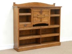 Edwardian oak secretaire bookcase with centre fall front compartment enclosing writing surface and