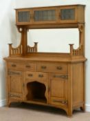 Early 20th century golden oak Arts and Crafts oak bevelled mirror back sideboard fitted with three