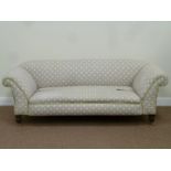 Victorian walnut framed double drop arm sofa upholstered in grey and white poker dot fabric,