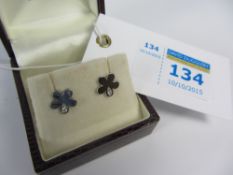 Pair of diamond set white gold flower ear-rings hallmarked 18ct retailed by Bright's Scarborough