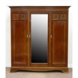Edwardian inlaid mahogany triple wardrobe enclosed by two panelled and one centre mirror glazed