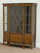 Edwardian inlaid mahogany serpentine breakfront display cabinet enclosed by single glazed door,