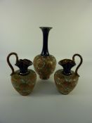 Royal Doulton stoneware vase, impressed marks to base, and a pair of similar Royal Doulton ewers