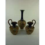 Royal Doulton stoneware vase, impressed marks to base, and a pair of similar Royal Doulton ewers