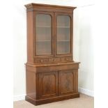 Victorian mahogany bookcase enclosed by two glazed doors above three drawers on chiffonier fitted