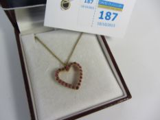 Ruby heart shaped pendant hallmarked 9ct on chain stamped 9ct