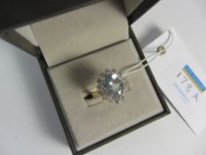 Aquamarine and diamond cluster ring hallmarked 18ct