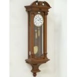 Gustave Becker: Late 19th century Vienna wall clock, double weight driven movement in walnut case,