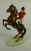 Beswick huntsman on rearing bay horse,