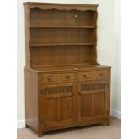 20th century medium oak two drawer, two cupboard dresser with plate rack, W124cm, H189cm,