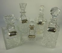 Liqueur decanter with hallmarked silver collar and four cut glass decanters,