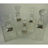 Liqueur decanter with hallmarked silver collar and four cut glass decanters,