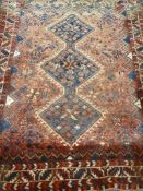 Persian Shiraz red ground rug,