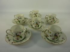 Set of six Crown Staffordshire coffee cans and saucers decorated with exotic birds and foliage