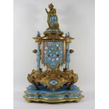 19th century French gilt metal boudoir clock with Sevres style porcelain dial and mounted blue