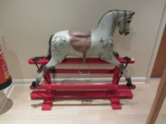 Mid 20th century dapple grey carved wooden rocking horse