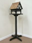 Handcrafted bird table in a Tudor style, cedar clad roof,
