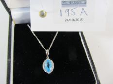 Diamond cluster blue stone pendant hallmarked 18ct on white gold chain hallmarked 9ct