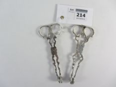 Two pairs hallmarked silver sugar nips maker's marks WH and LP